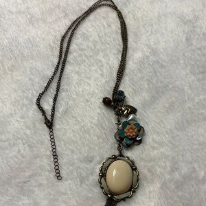 Vintage-Inspired Floral Pendant Necklace with Cream and Brown Accents